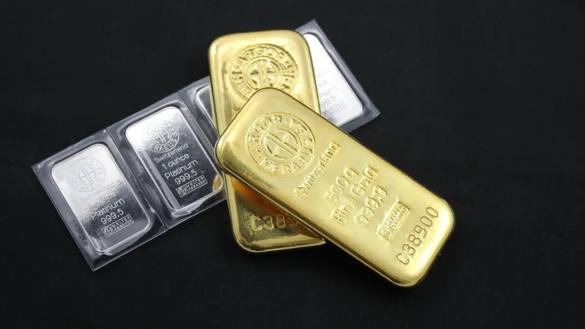Close-up of gold and platinum bars depicting wealth and investment potential.